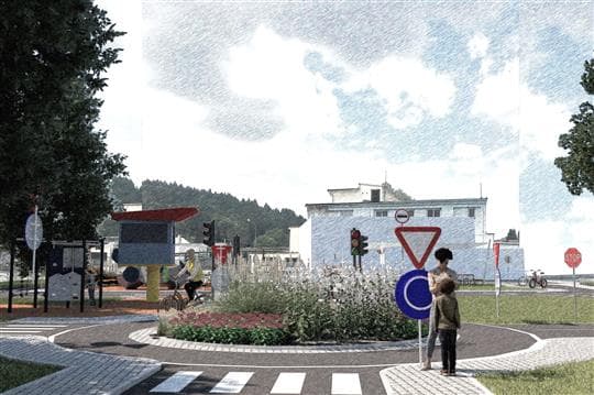 Vizualizace dětského dopravního hřiště u sv. Václava v Písku s kruhovým objezdem, semaforem, dopravními značkami a bílou budovou v pozadí